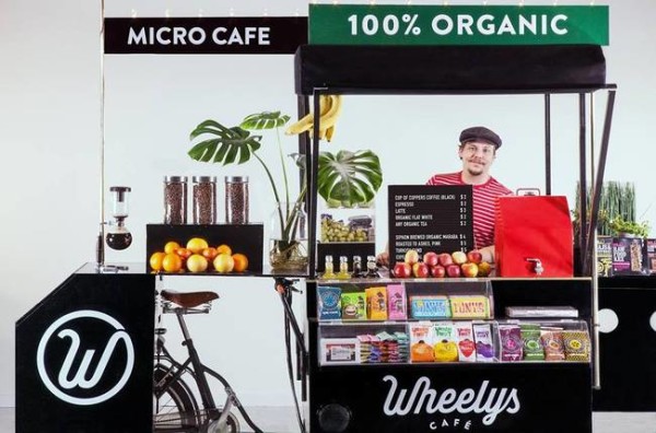 Who wouldn’t want to buy coffee at a solar powered bike cafe that cleans the air around it and recycles coffee grounds into flowers?